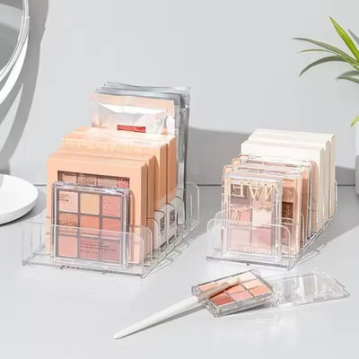 Nice Top Teck clear acrylic makeup palette organizers with 7 compartments for eyeshadows and blush on a vanity table